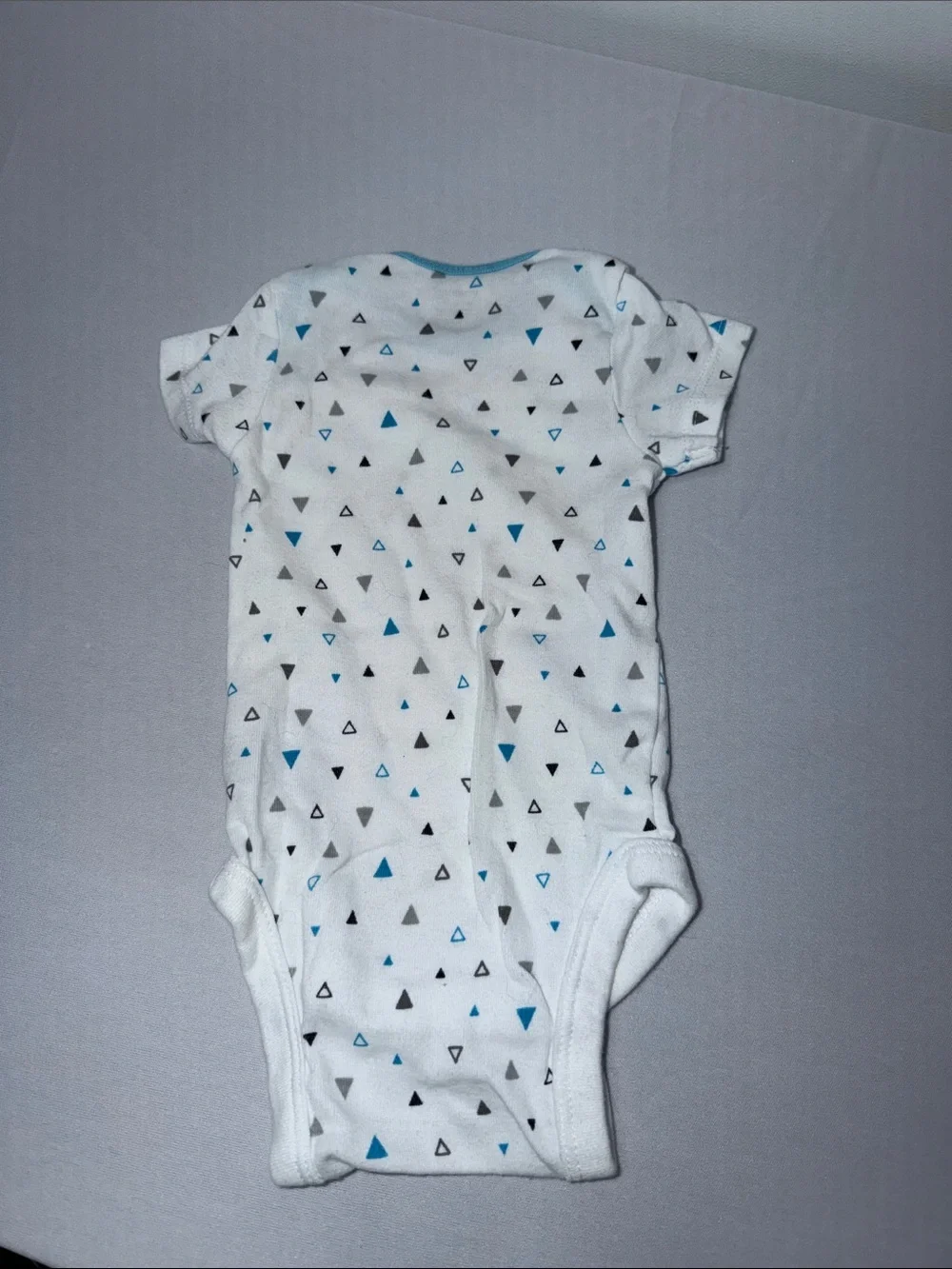 White Baby Onesie with Blue and Gray Triangle Print